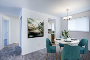 Brockport townhouse for rent - Staged dining area with carpet throughout