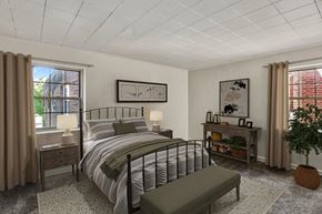 Rochester apartment for rent - staged bedroom with wall to wall carpeting