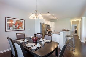 Webster apartment for rent - A dining room with a table set for four.