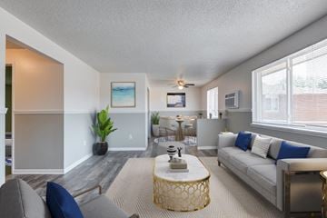 Rochester apartment for rent - a living room with a couch and a table