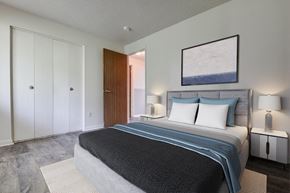 Rochester apartment for rent - a bedroom with a bed and a closet