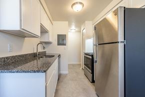 Rochester apartment for rent - a kitchen with stainless steel appliances and granite counter tops