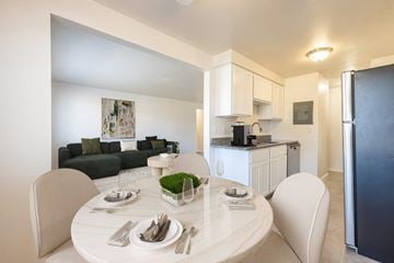 Rochester apartment for rent - a kitchen and living room with a table and chairs