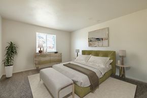Rochester apartment for rent - a bedroom with a bed and a window