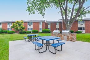 Rochester apartment for rent - our picnic area is in front of our building with benches and tables