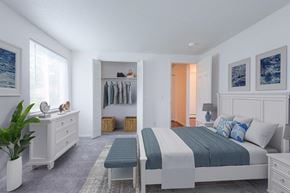 Rochester apartment for rent - a bedroom with a bed and a closet