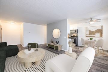 Rochester apartment for rent - a living room with a couch and a table