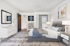 Rochester apartment for rent - a bedroom with a bed and a dresser