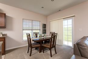 Watertown townhouse for rent - a dining room with a table and chairs and a couch