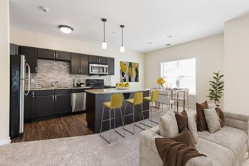 Rochester apartment for rent - a living room with a kitchen and a couch