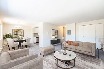Rochester apartment for rent - a living room with a couch and a table