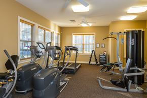 Webster apartment for rent - A gym with treadmills, elliptical machines, and other exercise equipment.