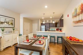 Webster apartment for rent - A dining room with a table set for a meal.