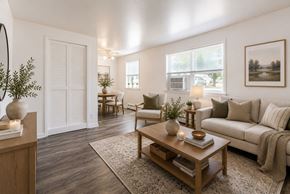 Penfield apartment for rent - A living room with a couch, chairs, and a coffee table.
