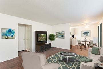 Penfield apartment for rent - a living room with a couch and a table