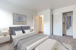 Penfield apartment for rent - a bedroom with a bed and a closet