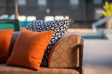 Lenexa townhouse for rent - a couch with pillows on it in a living room