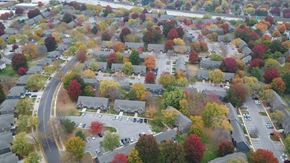 Lenexa townhouse for rent - an aerial view of a neighborhood with colorful trees