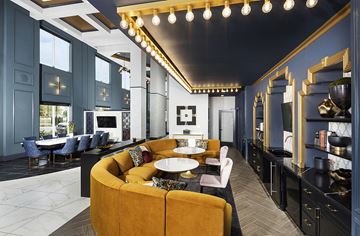Louisville apartment for rent - a living room with blue walls and a yellow couch and tables
