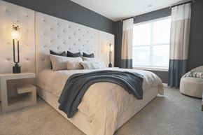 Louisville apartment for rent - a bedroom with a large bed and a window