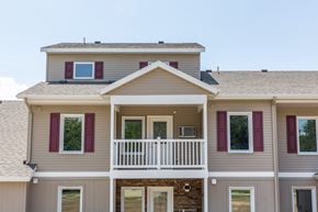 Grand Rapids apartment for rent - a large house with purple window shutters and a porch