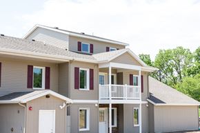 Grand Rapids apartment for rent - the exterior of a house with a porch and a balcony