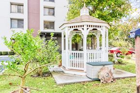 Jacksonville apartment for rent - gazebo surrounded by lush green landscaping