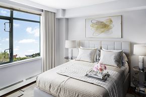 Calgary apartment for rent - bedroom with a bed, lamp, curtains and window