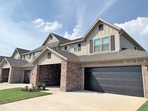 Bentonville townhouse for rent - Brick Building Exterior with garage