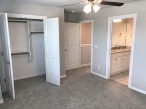 Bentonville townhouse for rent - C1 (1-car) Master Bed with carpet facing bathroom and closet
