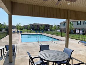 Bentonville townhouse for rent - Community Pool and patio with table and chairs
