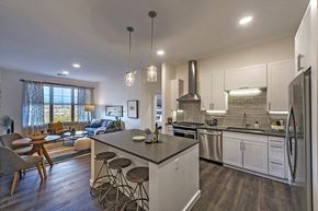 Hingham apartment for rent - A modern kitchen with a dining table and chairs.