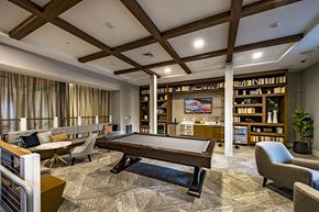 Hingham apartment for rent - A room with a pool table and a bookshelf.