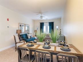 Rochester apartment for rent - a dining room with a table and chairs