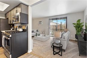 Jenison apartment for rent - an open living room with a kitchen and a living room