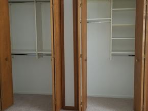 Shelby Twp apartment for rent - an empty closet with two doors and a carpeted floor
