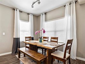 Sherman apartment for rent - A dining room with a wooden table and chairs.
