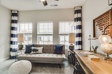 Romeoville apartment for rent - a living room with a couch and a desk and windows