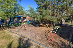 Vandalia apartment for rent - a playground with a swing set and a slide in a backyard