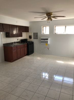 Paterson apartment for rent - A kitchen with a fan and a counter.