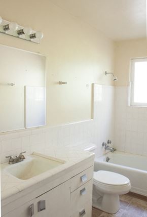 Salt Lake City apartment for rent - A white bathroom with a sink, toilet, and bathtub.