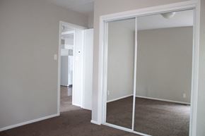 Salt Lake City apartment for rent - A room with a white door and a carpeted floor.