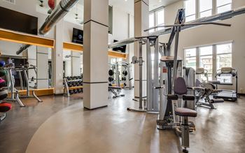 Bi-level 24-hour fitness center for cardio and strength training