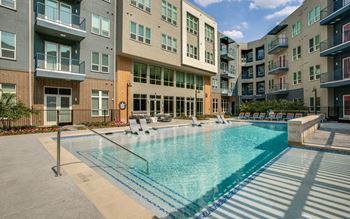 Expansive resort style pool with grilling stations
