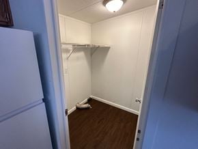 Shawnee house for rent - A white closet with a white door and a white shelf.