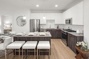 Glen Cove apartment for rent - a kitchen and dining area with a table and chairs