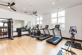 Portland apartment for rent - a gym with treadmills and other exercise equipment in a room with windows