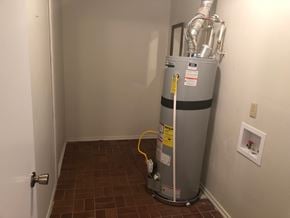 Guthrie house for rent - A water heater is in a corner of a room.