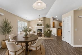 Farmington apartment for rent - A dining room with a wooden table and chairs.