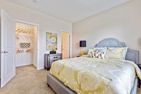 North Chili apartment for rent - a bedroom with a bed and a door to a closet